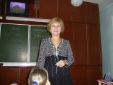 У классной доски.